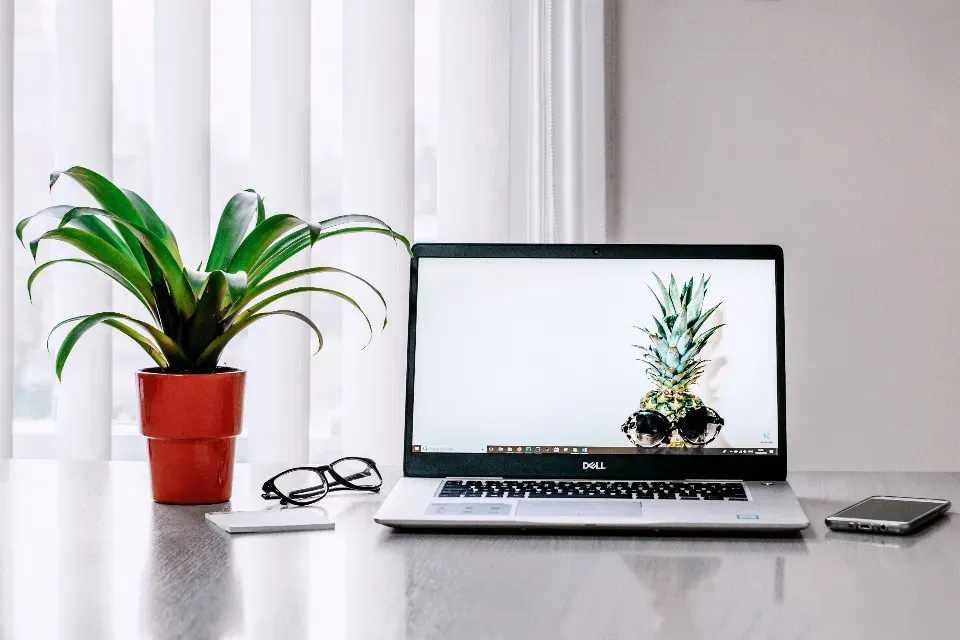 Laptop and phone on a clean office desk